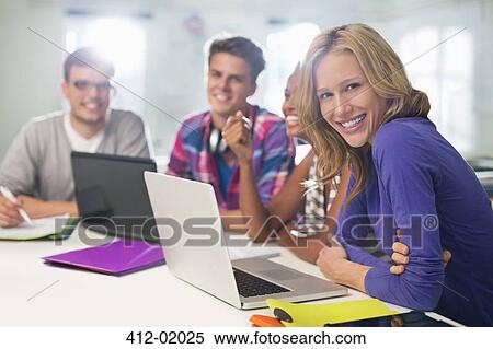 Stock Photography - Business people sitting in meeting. Fotosearch