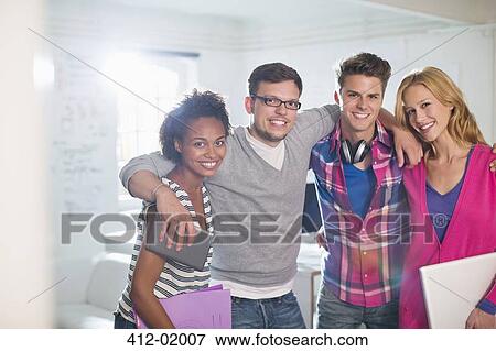 Stock Photo - Business people smiling in office. Fotosearch