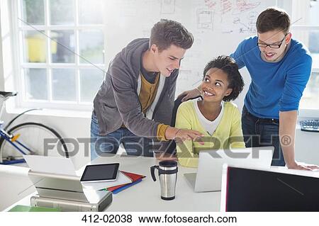 Business people talking at desk View Large Photo Image Stock Photo - Business people talking at desk. Fotosearch