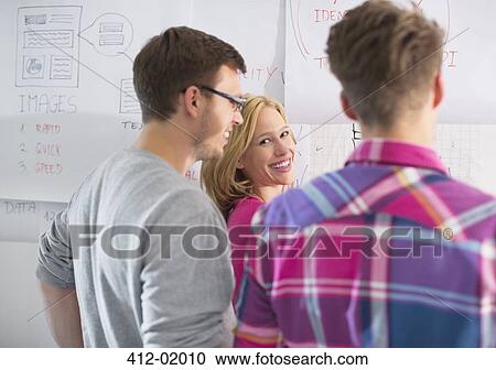 Stock Image - Business people talking in office. Fotosearch