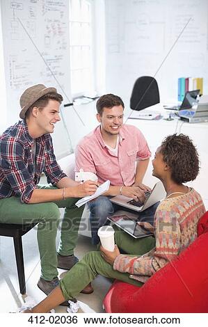 Stock Photograph - Business people talking in office. Fotosearch
