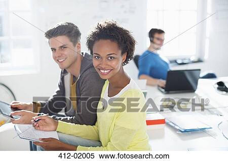 Stock Photography - Business people talking in office. Fotosearch