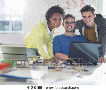 Business people working together at desk View Large Photo Image Stock Image - Business people working together at desk. Fotosearch