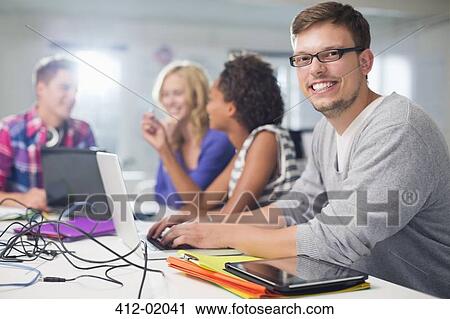 Businessman smiling in meeting View Large Photo Image Stock Image - Businessman smiling in meeting. Fotosearch