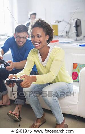 Stock Photography - Couple playing video games together. Fotosearch