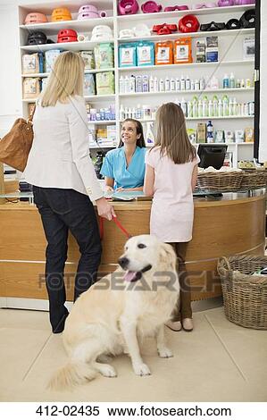 Owner bringing dog to vet's surgery View Large Photo Image Stock Photography - Owner bringing dog to vet's surgery. Fotosearch