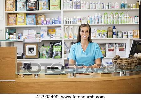 Receptionist at front desk of vet's surgery View Large Photo Image Stock Photo - Receptionist at front desk of vet's surgery. Fotosearch