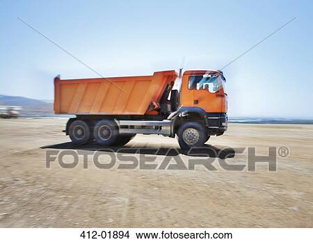 Picture - Blurred view of truck on site. Fotosearch