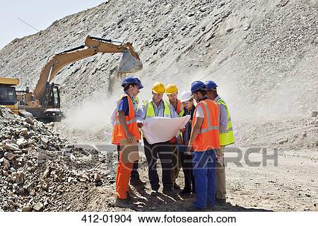 Business people and workers talking in quarry View Large Photo Image Picture - Business people and workers talking in quarry. Fotosearch
