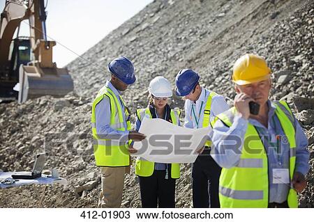 Business people talking in quarry View Large Photo Image Stock Image - Business people talking in quarry. Fotosearch