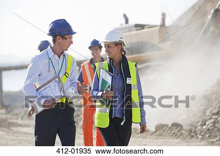 Business people talking in quarry View Large Photo Image Stock Photography - Business people talking in quarry. Fotosearch