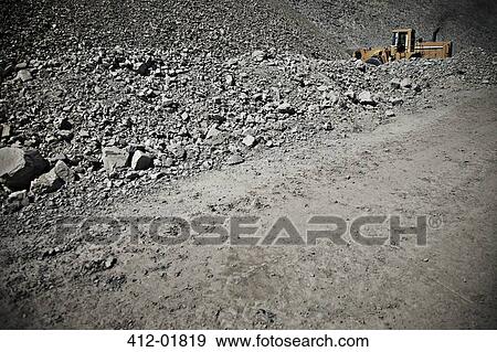 Digger driving in quarry View Large Photo Image Stock Photo - Digger driving in quarry. Fotosearch