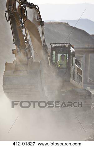 Digger working in quarry View Large Photo Image Stock Photo - Digger working in quarry. Fotosearch