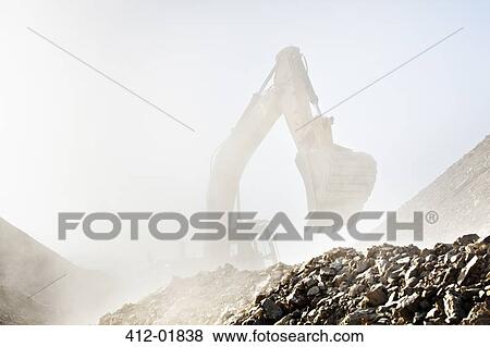 Digger working in quarry View Large Photo Image Stock Photo - Digger working in quarry. Fotosearch