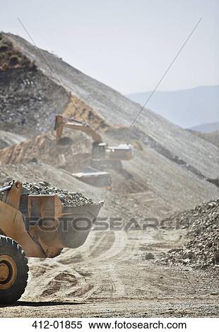 Diggers working in quarry View Large Photo Image Stock Photography - Diggers working in quarry. Fotosearch