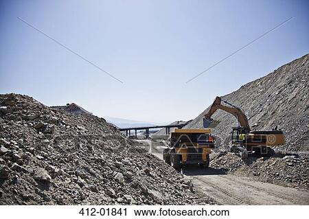 Machinery at work in quarry View Large Photo Image Stock Image - Machinery at work in quarry. Fotosearch