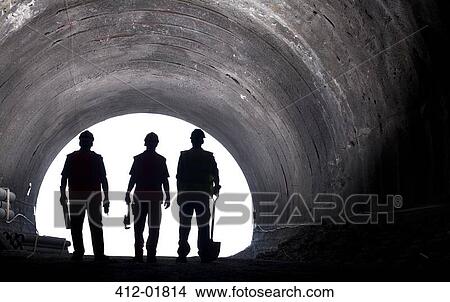 Silhouette of workers in tunnel View Large Photo Image Picture - Silhouette of workers in tunnel. Fotosearch