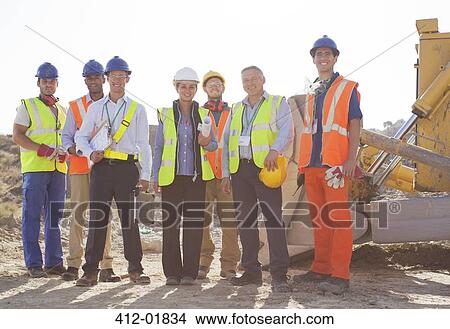 Workers and business people smiling at quarry View Large Photo Image Picture - Workers and business people smiling at quarry. Fotosearch