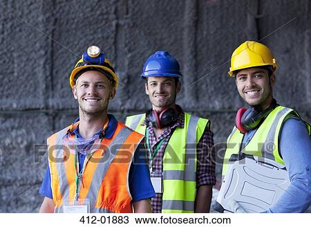 Workers smiling on site View Large Photo Image Stock Image - Workers smiling on site. Fotosearch