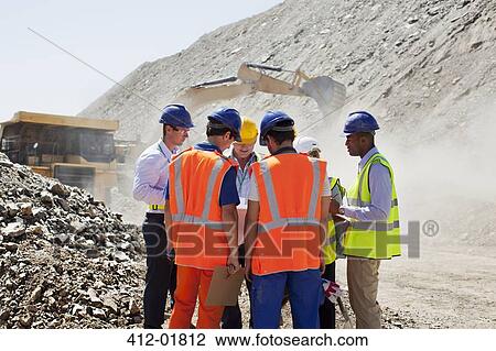 Workers talking in quarry View Large Photo Image Stock Image - Workers talking in quarry. Fotosearch