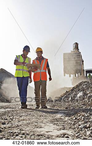 Workers talking in quarry View Large Photo Image Stock Image - Workers talking in quarry. Fotosearch