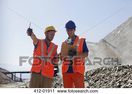 Workers talking in quarry View Large Photo Image Stock Image - Workers talking in quarry. Fotosearch