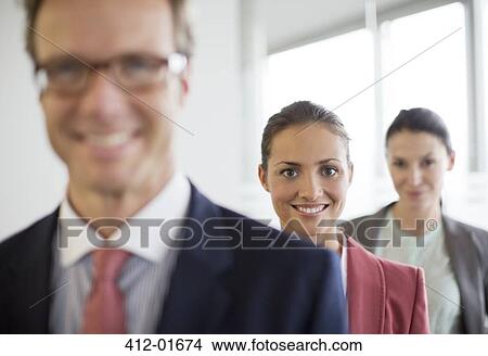 Business people smiling in office View Large Photo Image Picture - Business people smiling in office. Fotosearch