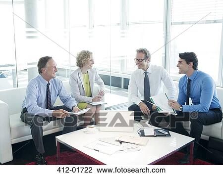 Business people talking in lobby area View Large Photo Image Stock Image - Business people talking in lobby area. Fotosearch