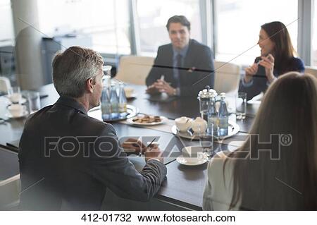 Business people talking in meeting View Large Photo Image Stock Image - Business people talking in meeting. Fotosearch