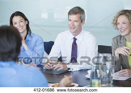 Business people talking in meeting View Large Photo Image Stock Photograph - Business people talking in meeting. Fotosearch