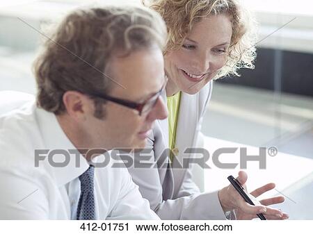 Business people talking in office View Large Photo Image Stock Image - Business people talking in office. Fotosearch