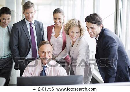 Business people using computer in office View Large Photo Image Stock Photograph - Business people using computer in office. Fotosearch