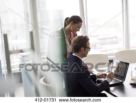 Stock Image - Business people working in office. Fotosearch