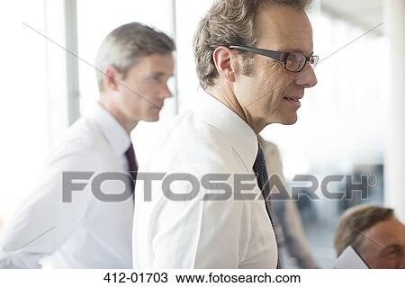 Businessmen talking in meeting View Large Photo Image Stock Image - Businessmen talking in meeting. Fotosearch
