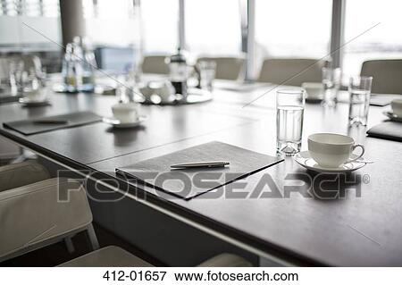 Table set for meeting in office View Large Photo Image Stock Photo - Table set for meeting in office. Fotosearch