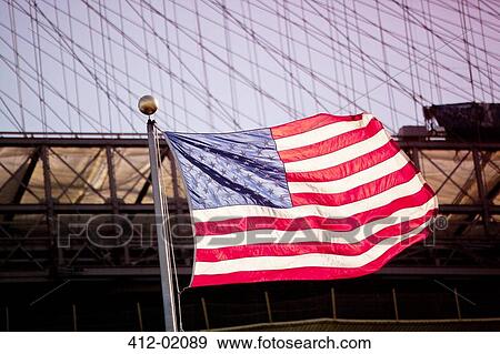American flag waving by urban bridge View Large Photo Image Stock Photo - American flag waving by urban bridge. Fotosearch
