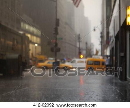 Blurred view of rainy city street View Large Photo Image Stock Image - Blurred view of rainy city street. Fotosearch