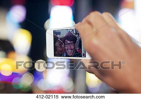 Stock Photography - Close up of photo on cell phone screen. Fotosearch
