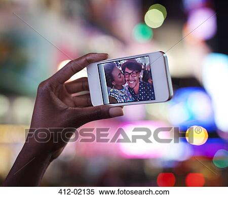 Close up of photo on cell phone screen View Large Photo Image Stock Photography - Close up of photo on cell phone screen. Fotosearch