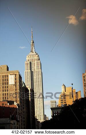 Highrise in urban cityscape View Large Photo Image Stock Photo - Highrise in urban cityscape. Fotosearch