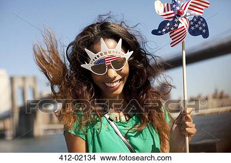 Woman in novelty sunglasses with pinwheel View Large Photo Image Picture - Woman in novelty sunglasses with pinwheel. Fotosearch