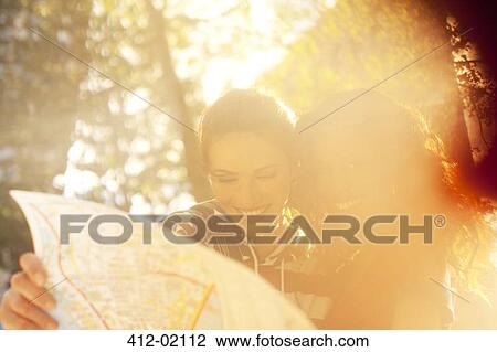 Women looking at roadmap outdoors View Large Photo Image Stock Image - Women looking at roadmap outdoors. Fotosearch