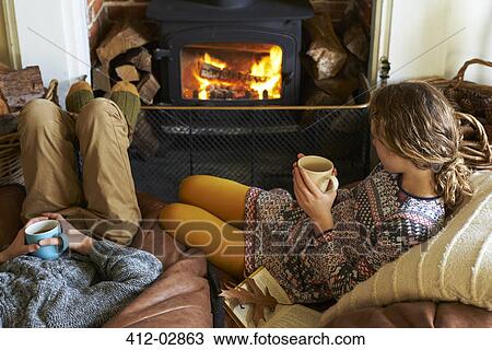 Children drinking cups of tea by fire View Large Photo Image Stock Image - Children drinking cups of tea by fire. Fotosearch