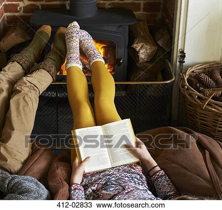 Children relaxing by fire View Large Photo Image Stock Image - Children relaxing by fire. Fotosearch