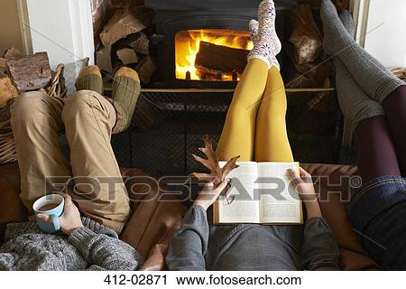 Children relaxing by fire View Large Photo Image Stock Image - Children relaxing by fire. Fotosearch