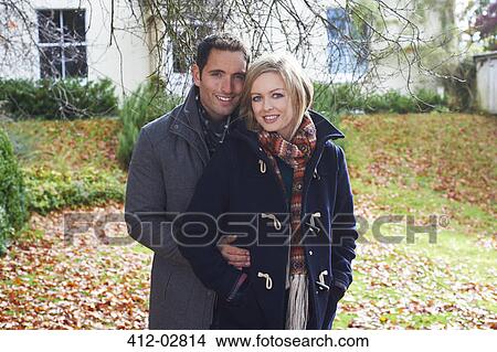 Picture - Couple smiling together outdoors. Fotosearch
