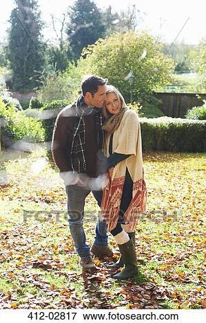 Couple smiling together outdoors View Large Photo Image Stock Photo - Couple smiling together outdoors. Fotosearch