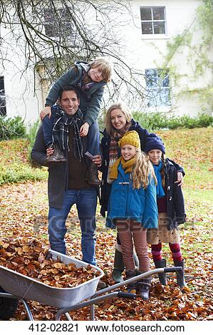 Stock Image - Family smiling together outdoors. Fotosearch