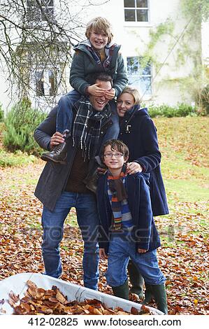 Stock Photography - Family smiling together outdoors. Fotosearch