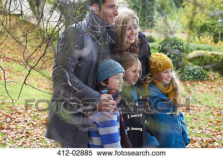 Family smiling together outdoors View Large Photo Image Stock Photography - Family smiling together outdoors. Fotosearch